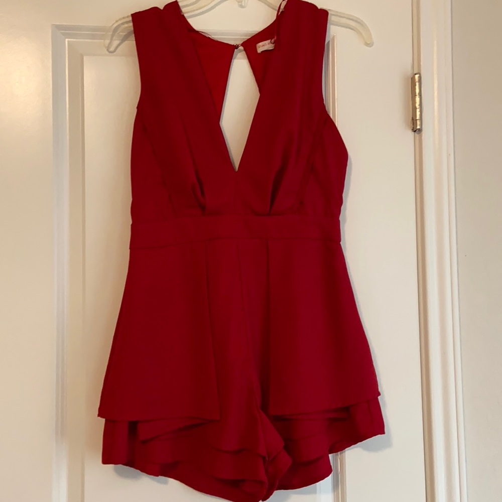 Red jumpsuit Romper. Pleated front. Open back. Size medium. Brand A’gaci
